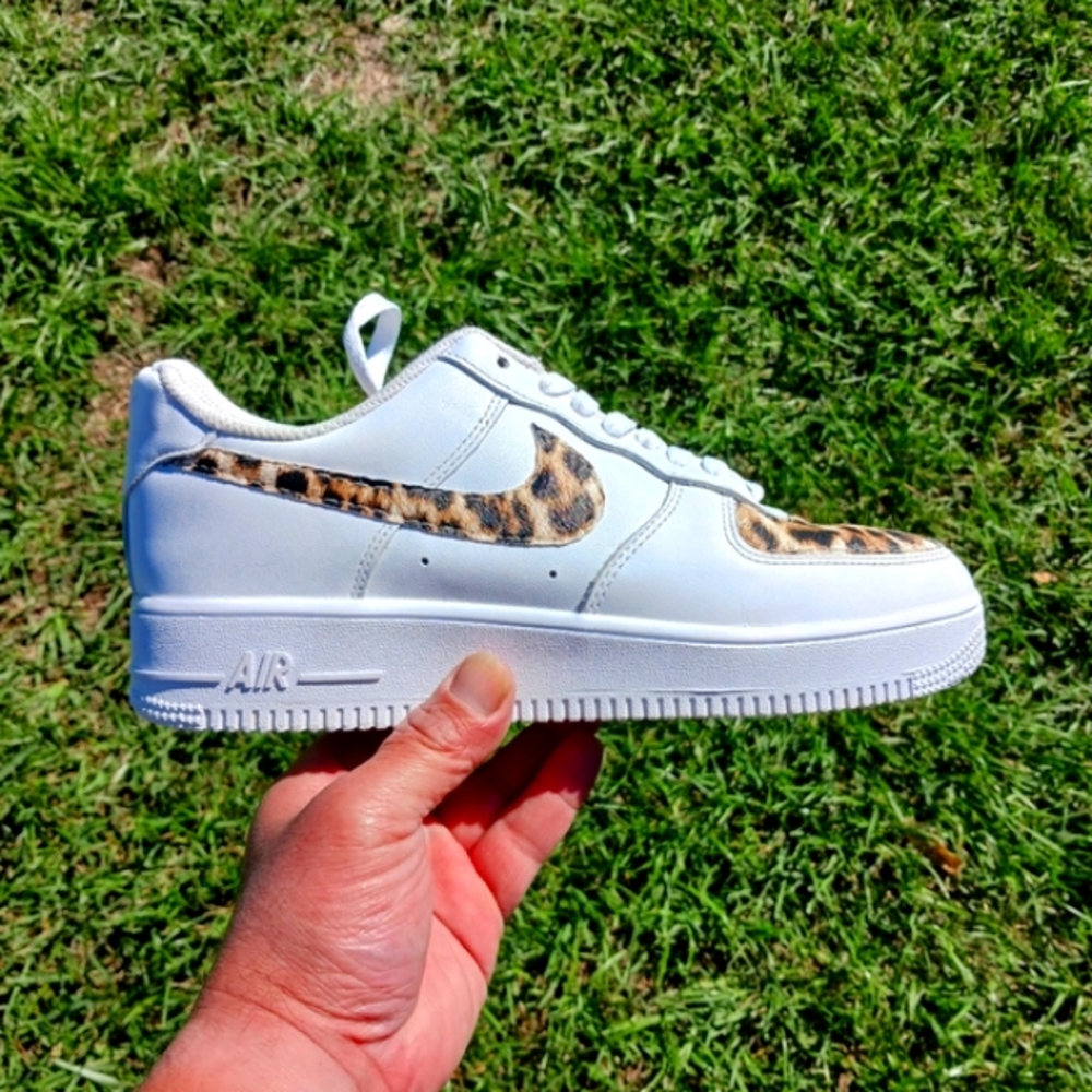Nike White Athletic Shoes with Leopard Swoosh Accent
